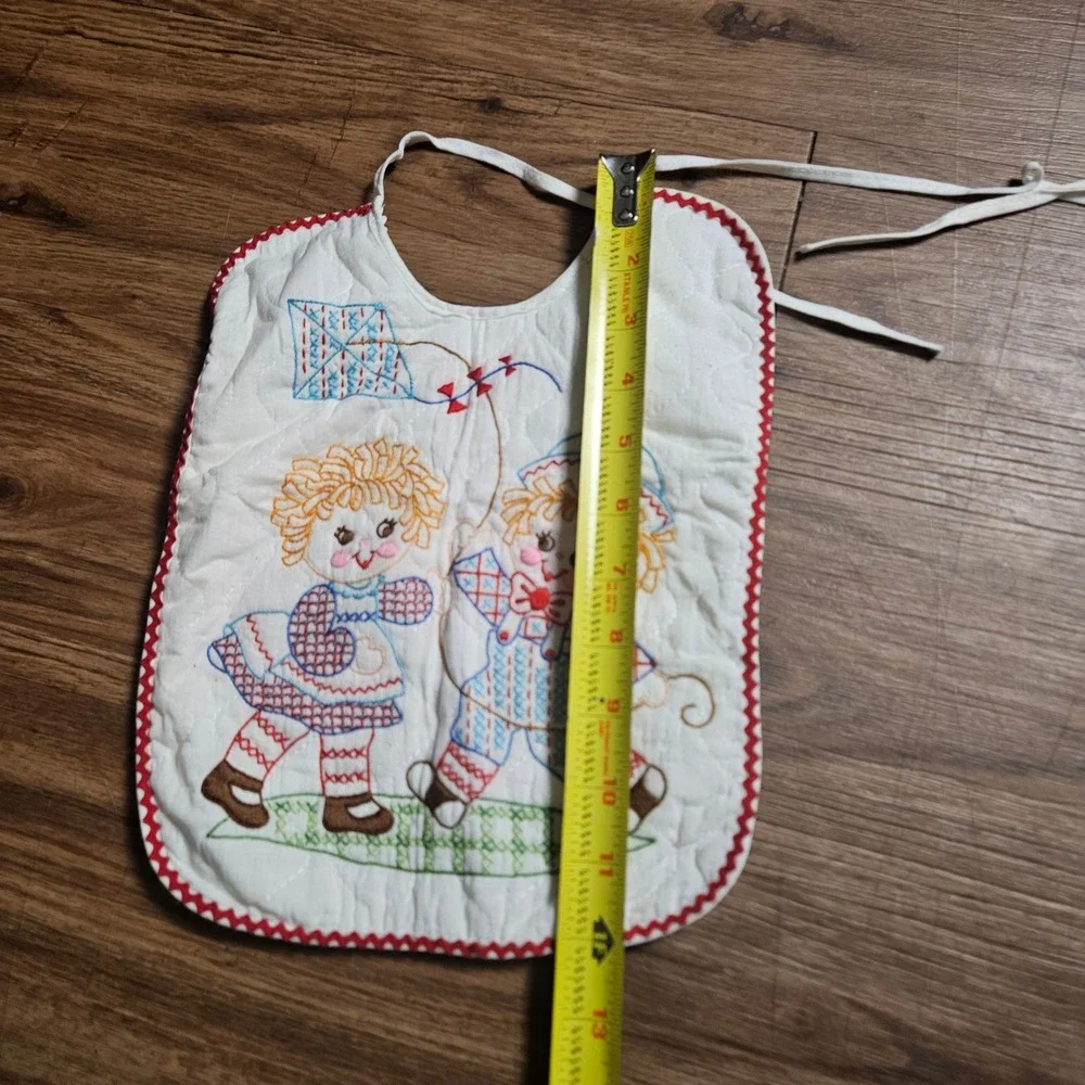 Lot of 2 Vintage Quilted Baby Bibs Embroidered Raggedy Ann Kite Swing Ric Rac
